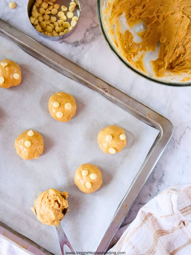Close-up of banana pudding cookies with white chocolate chips and a light, fluffy texture.