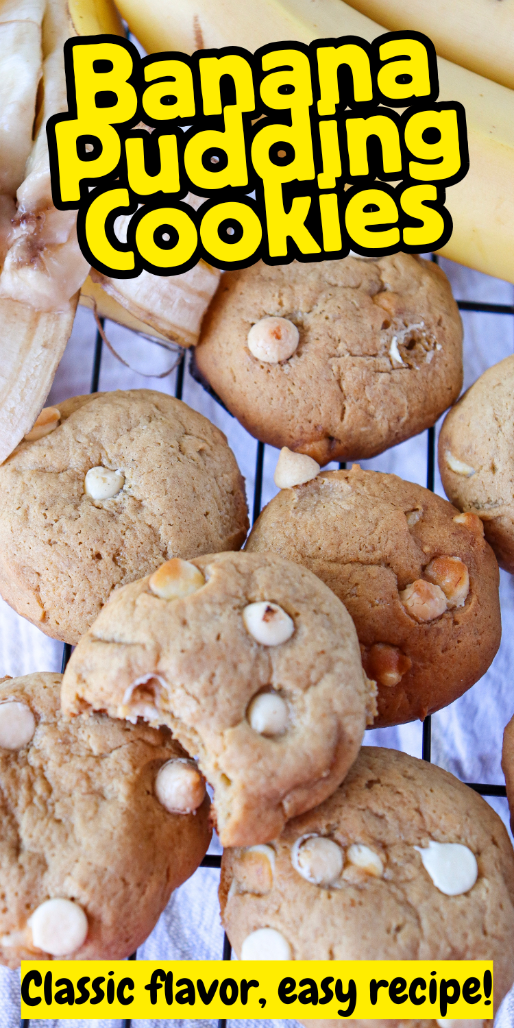 Soft and chewy banana pudding cookies stacked on a cooling rack, with white chocolate chips visible.
